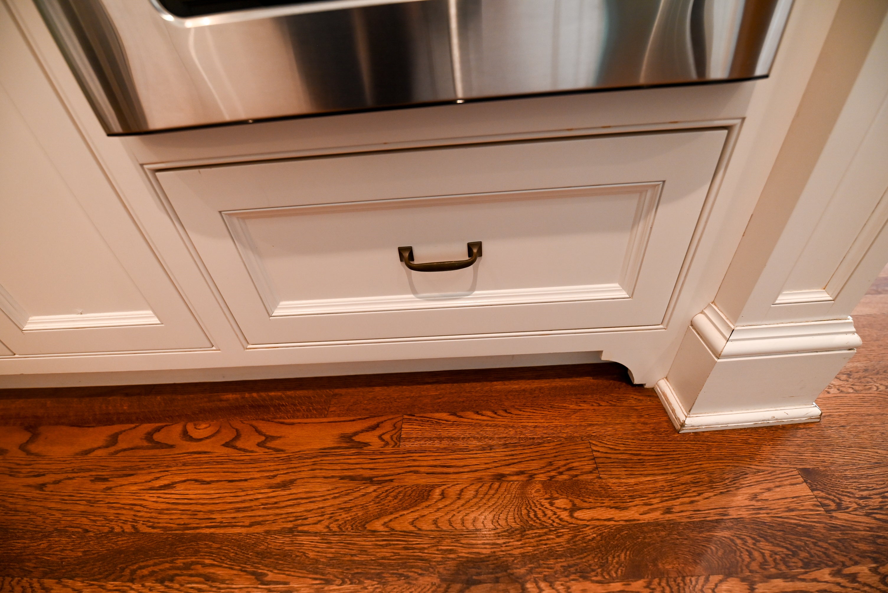 "The Montclair" Transitional White Kitchen with Island & Wolf 48" Range