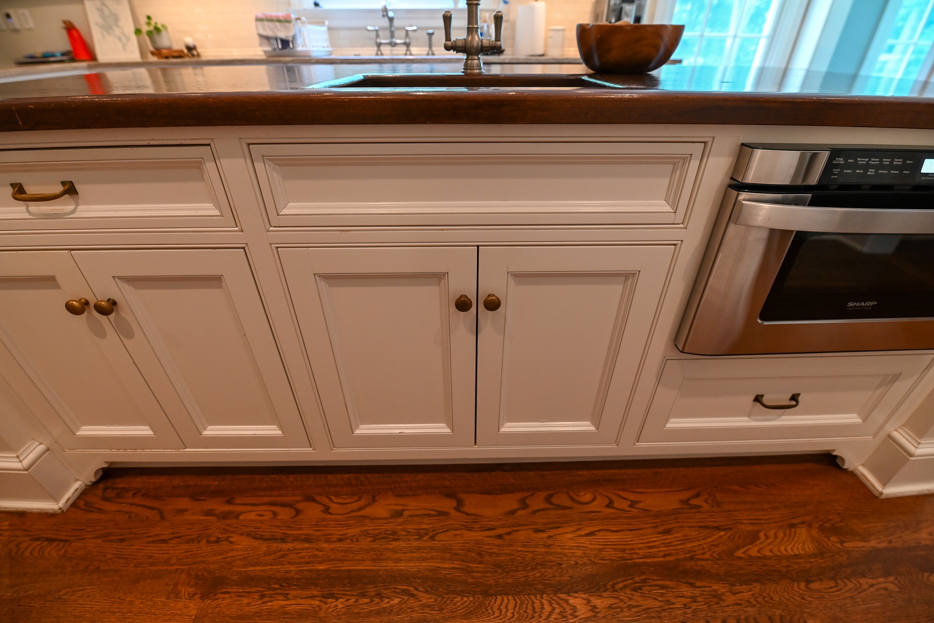 "The Montclair" Transitional White Kitchen with Island & Wolf 48" Range
