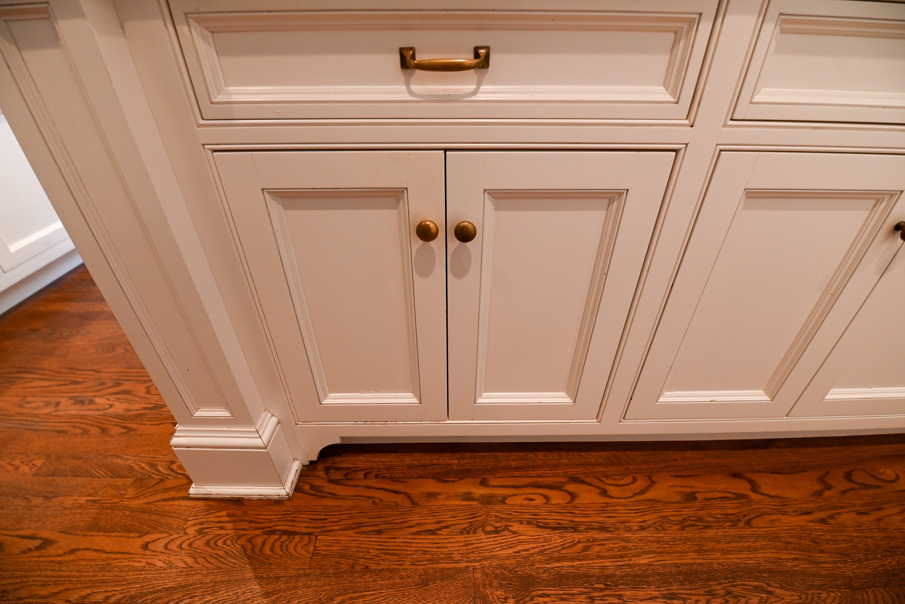 "The Montclair" Transitional White Kitchen with Island & Wolf 48" Range