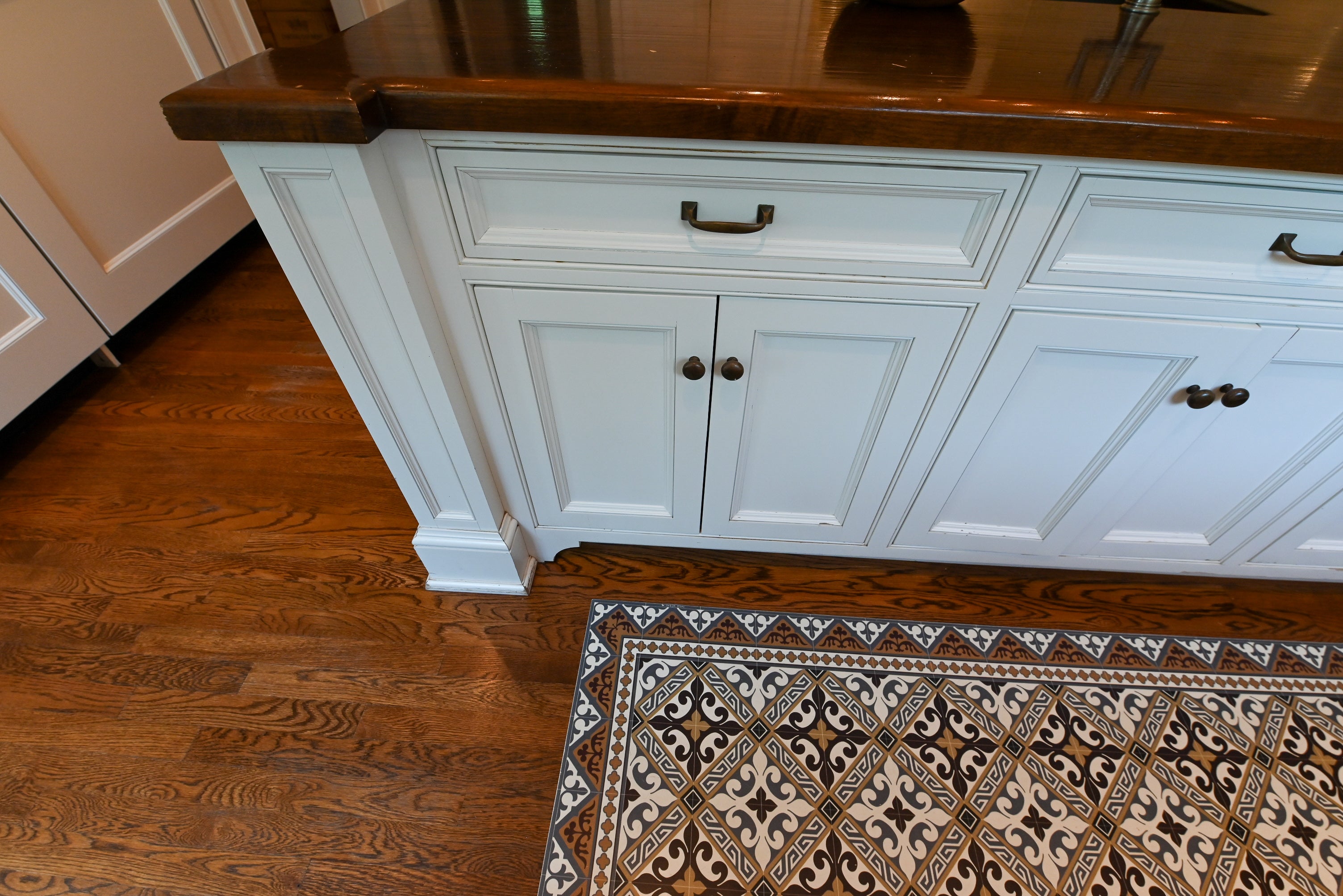 "The Montclair" Transitional White Kitchen with Island & Wolf 48" Range