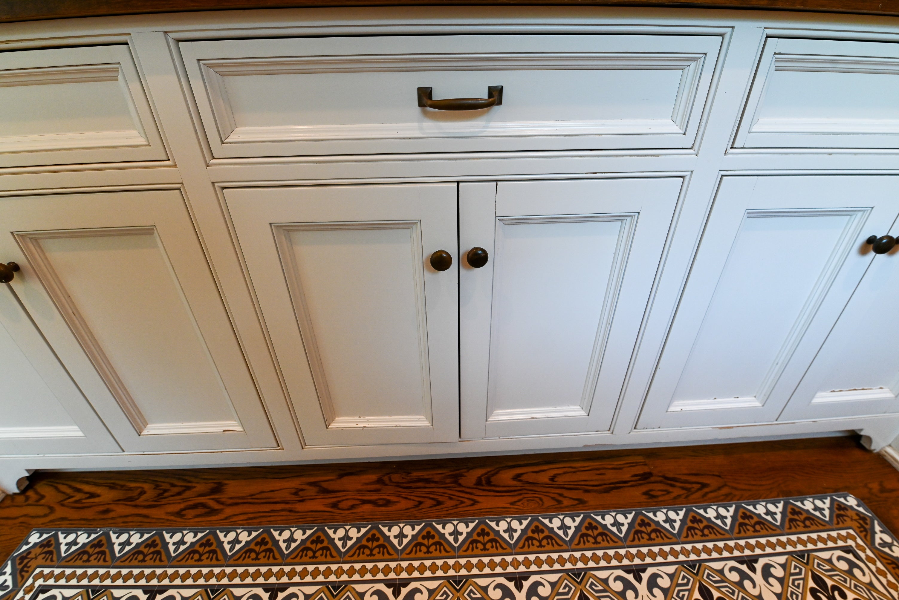 "The Montclair" Transitional White Kitchen with Island & Wolf 48" Range