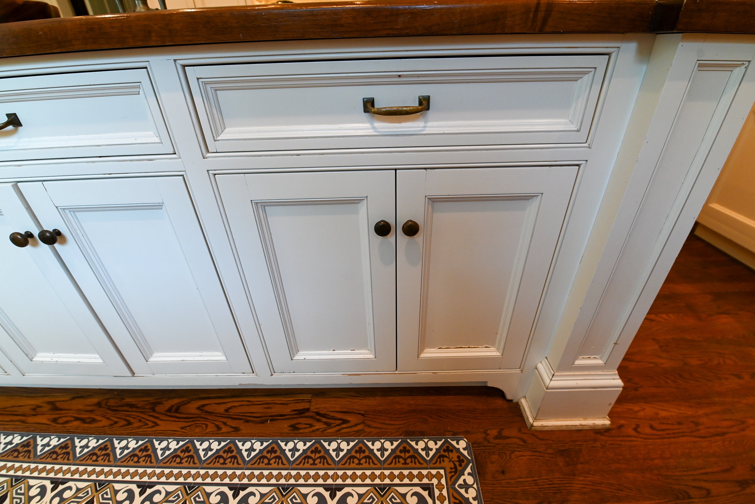 "The Montclair" Transitional White Kitchen with Island & Wolf 48" Range