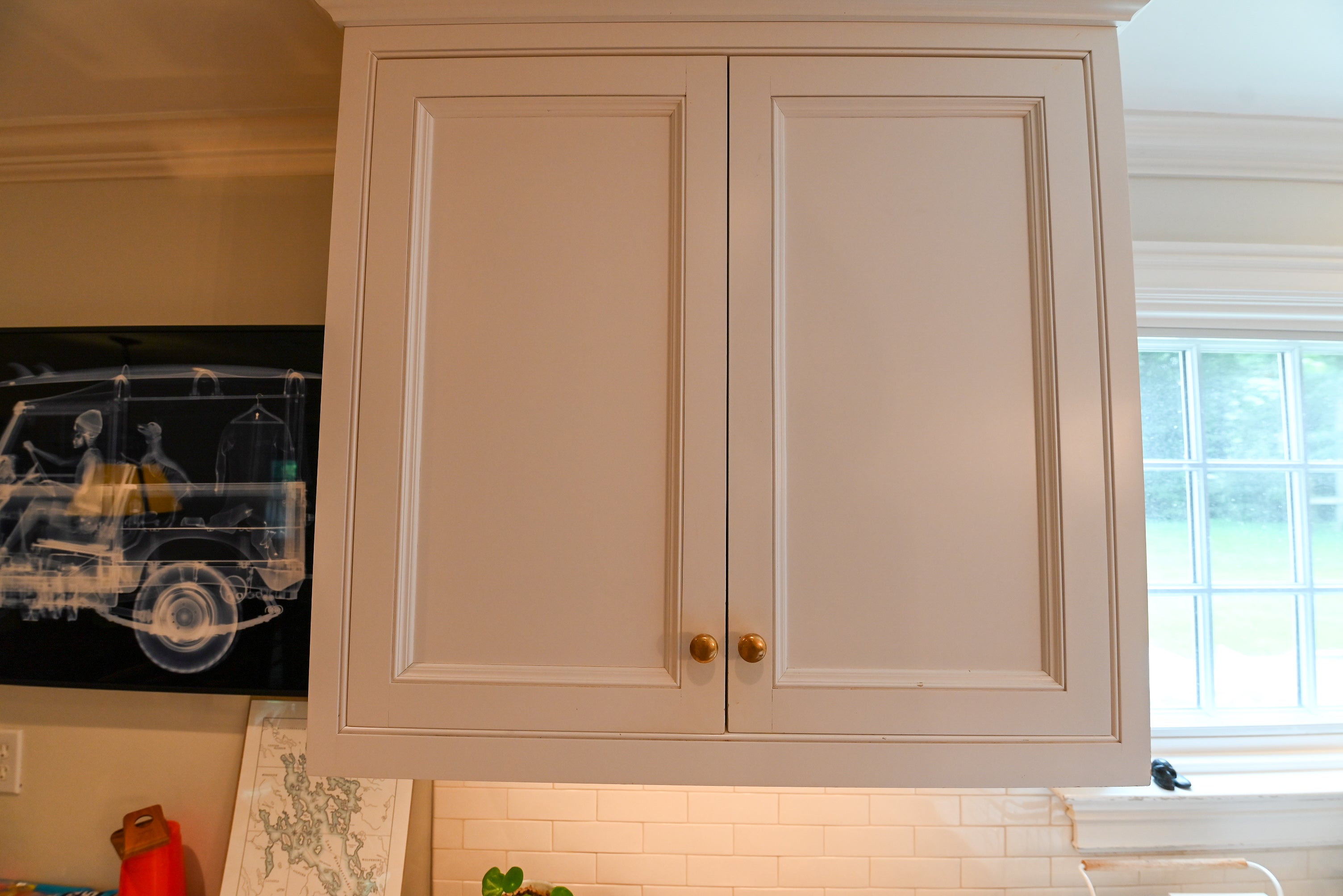 "The Montclair" Transitional White Kitchen with Island & Wolf 48" Range