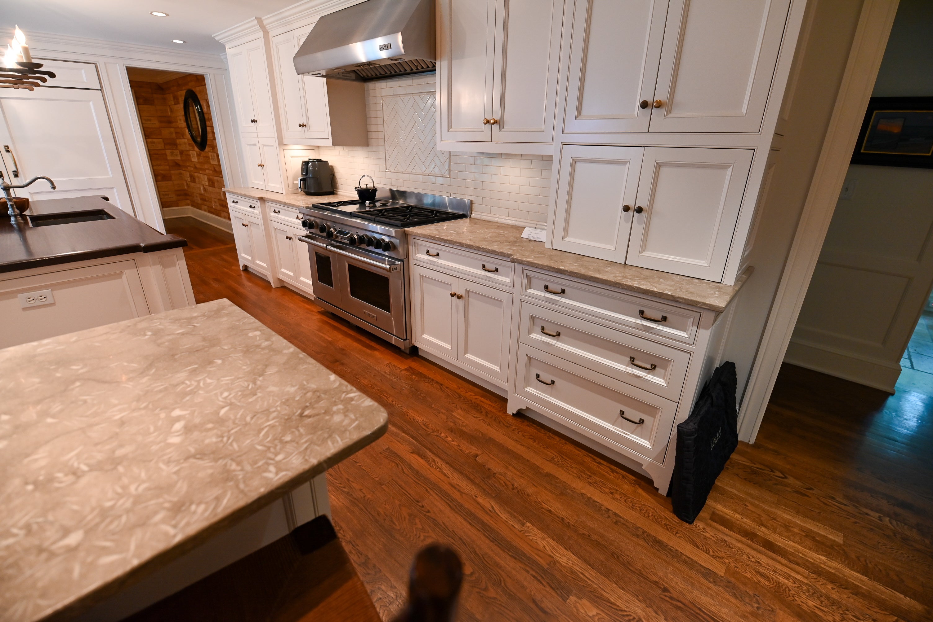 "The Montclair" Transitional White Kitchen with Island & Wolf 48" Range