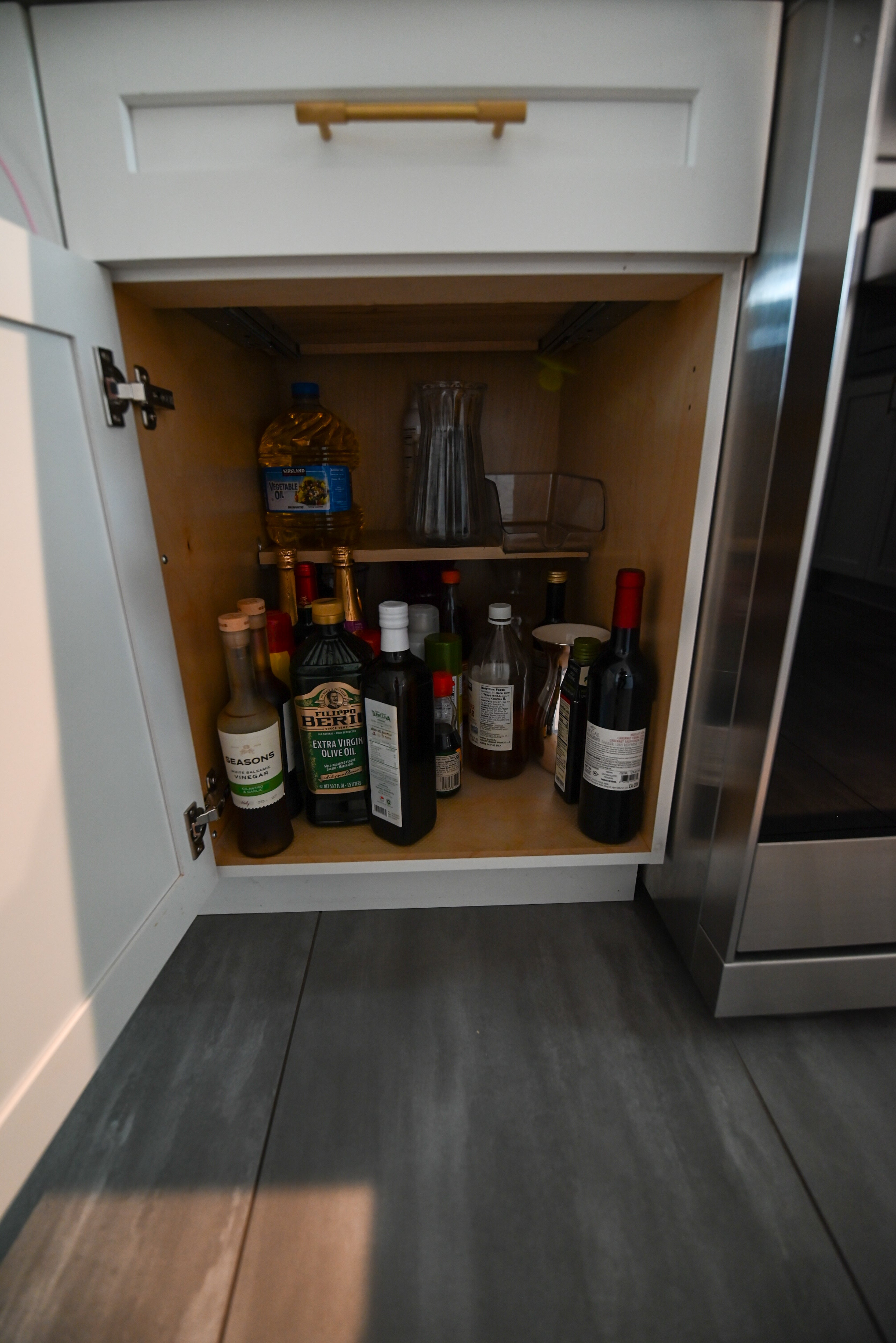 "The Lexington" Transitional White Kitchen with Black Island & Appliances