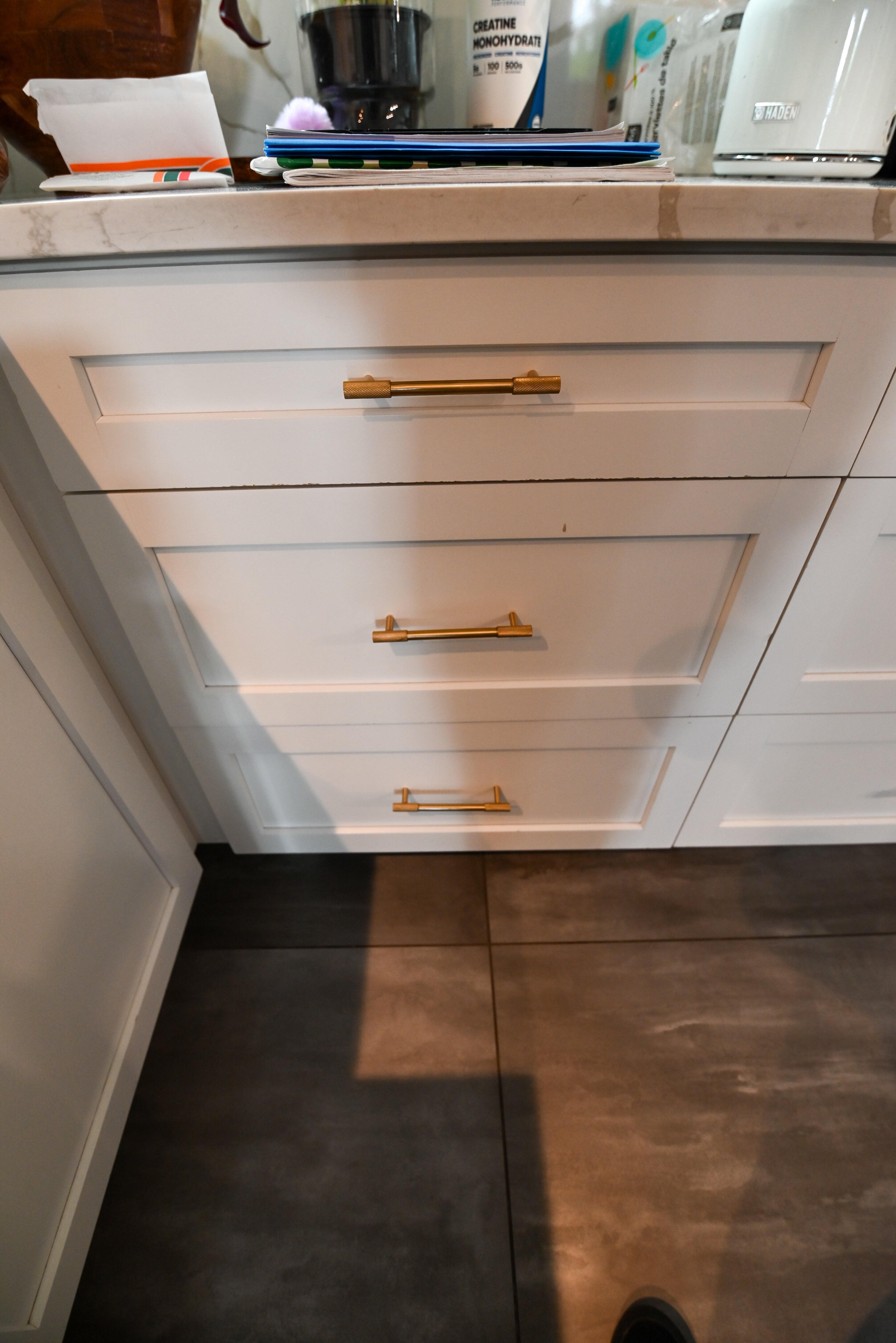 "The Lexington" Transitional White Kitchen with Black Island & Appliances