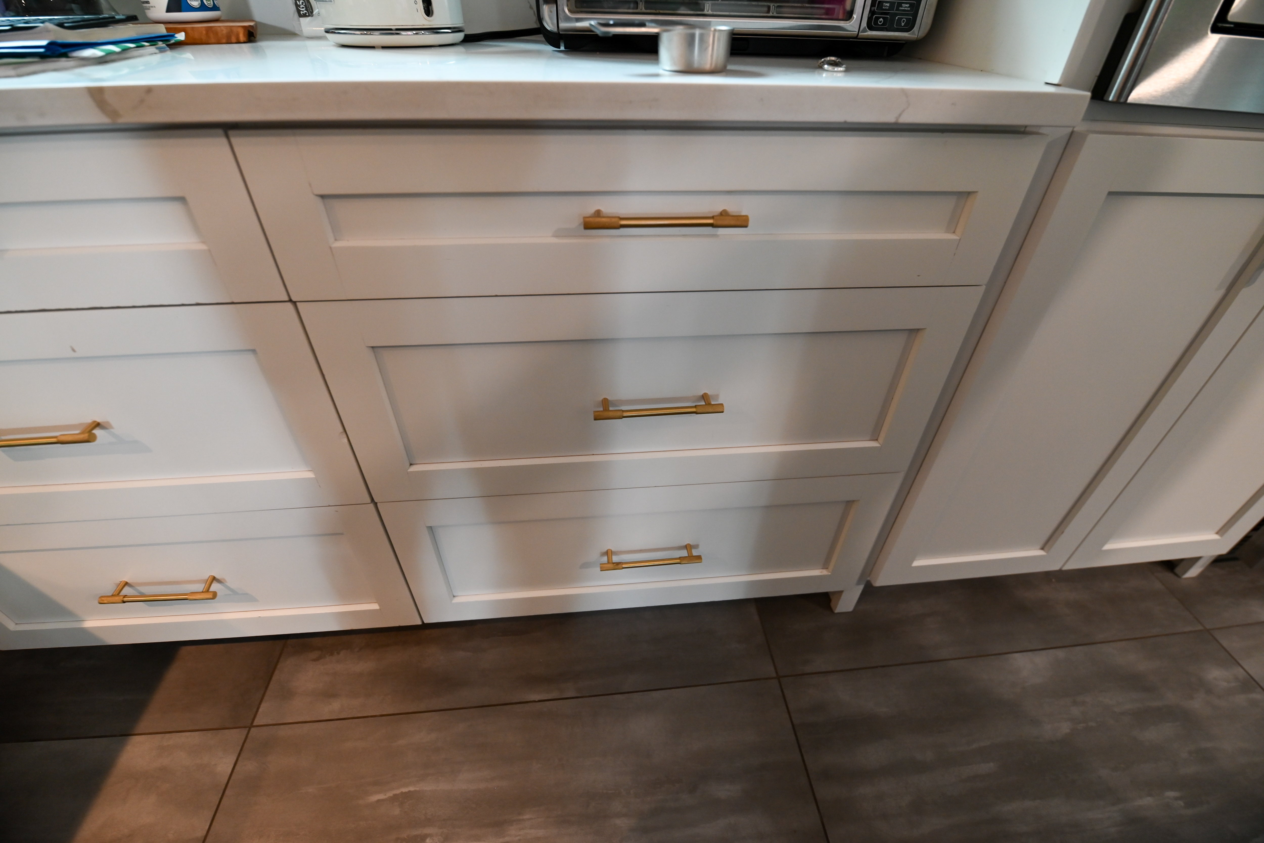 "The Lexington" Transitional White Kitchen with Black Island & Appliances