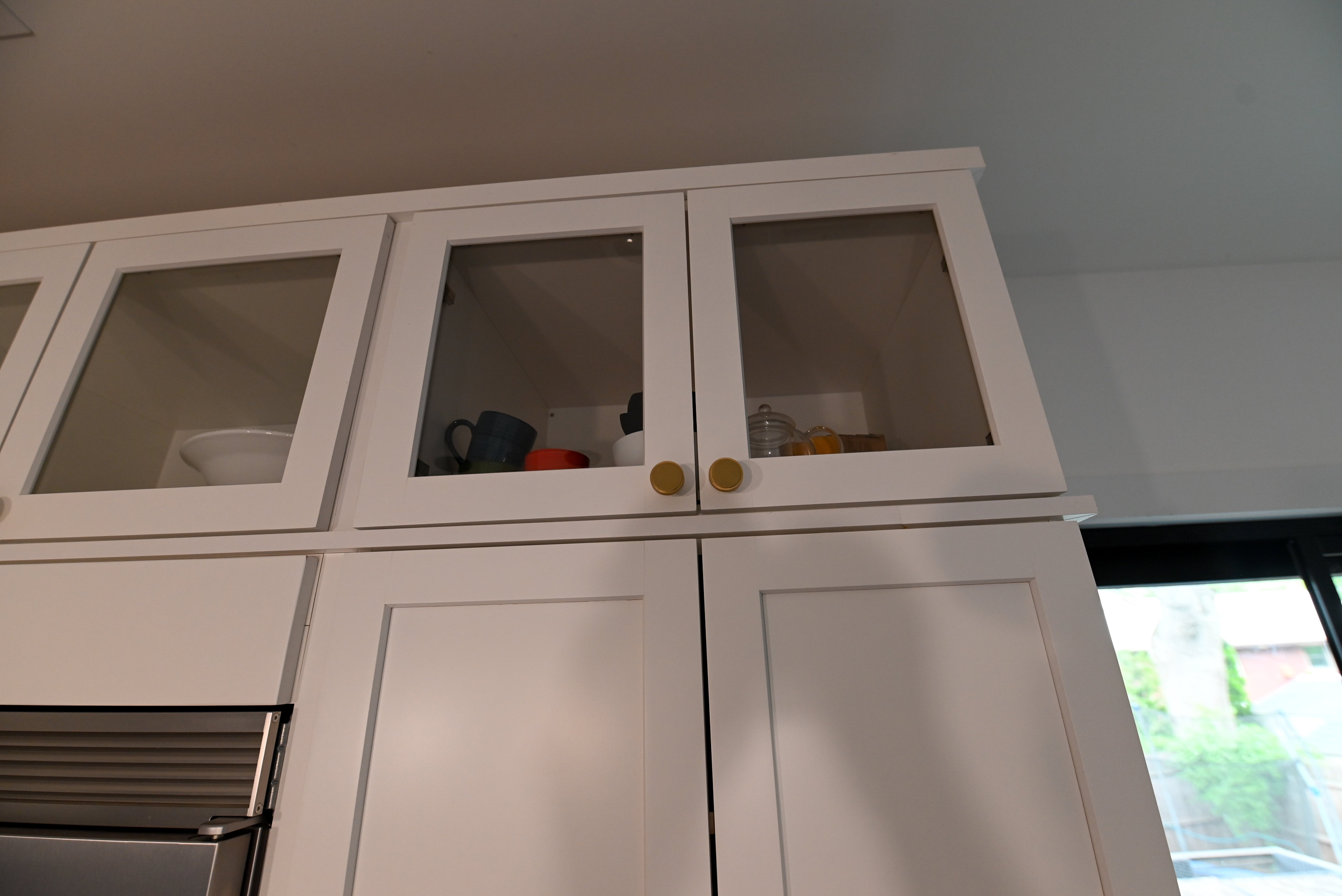 "The Lexington" Transitional White Kitchen with Black Island & Appliances
