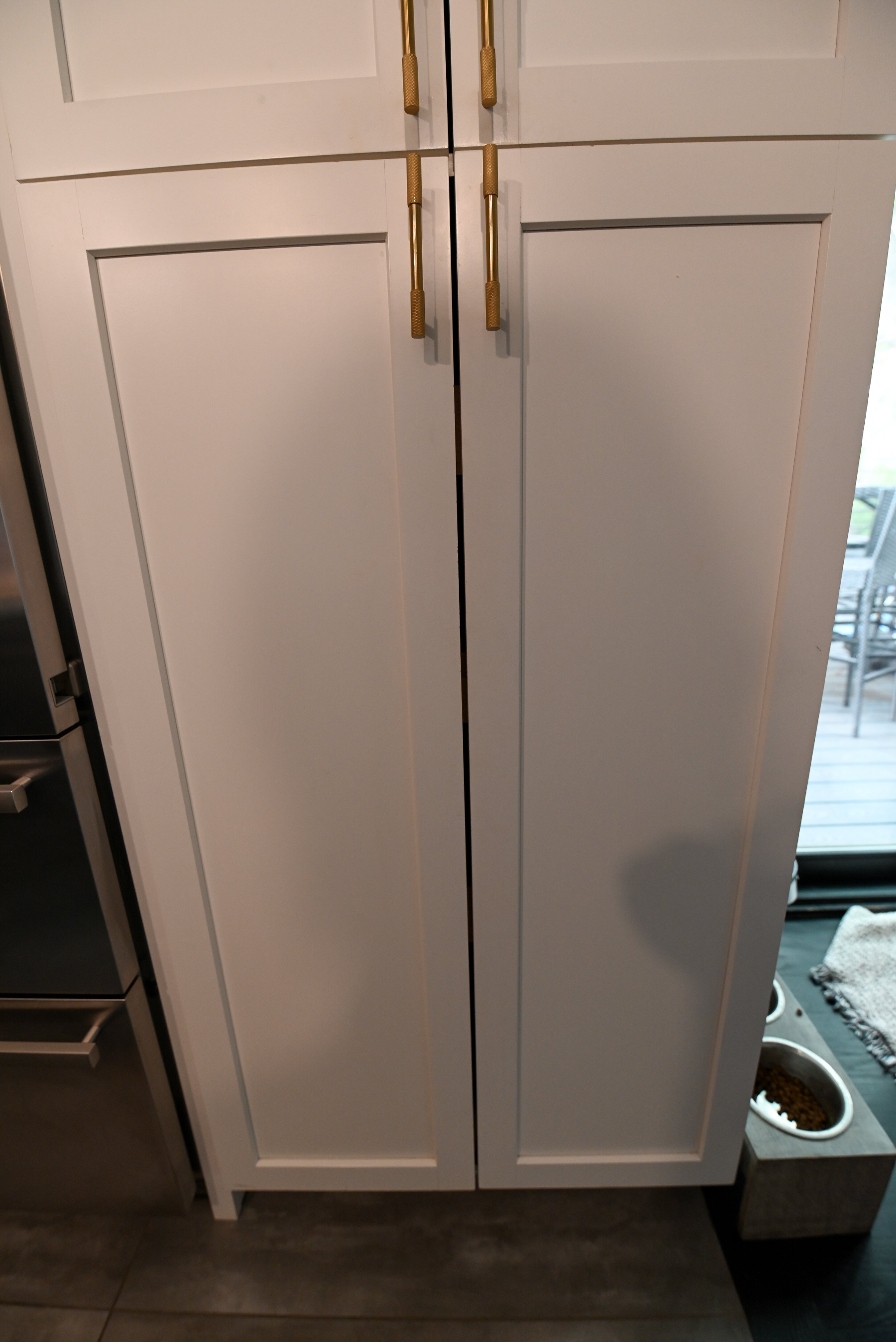 "The Lexington" Transitional White Kitchen with Black Island & Appliances