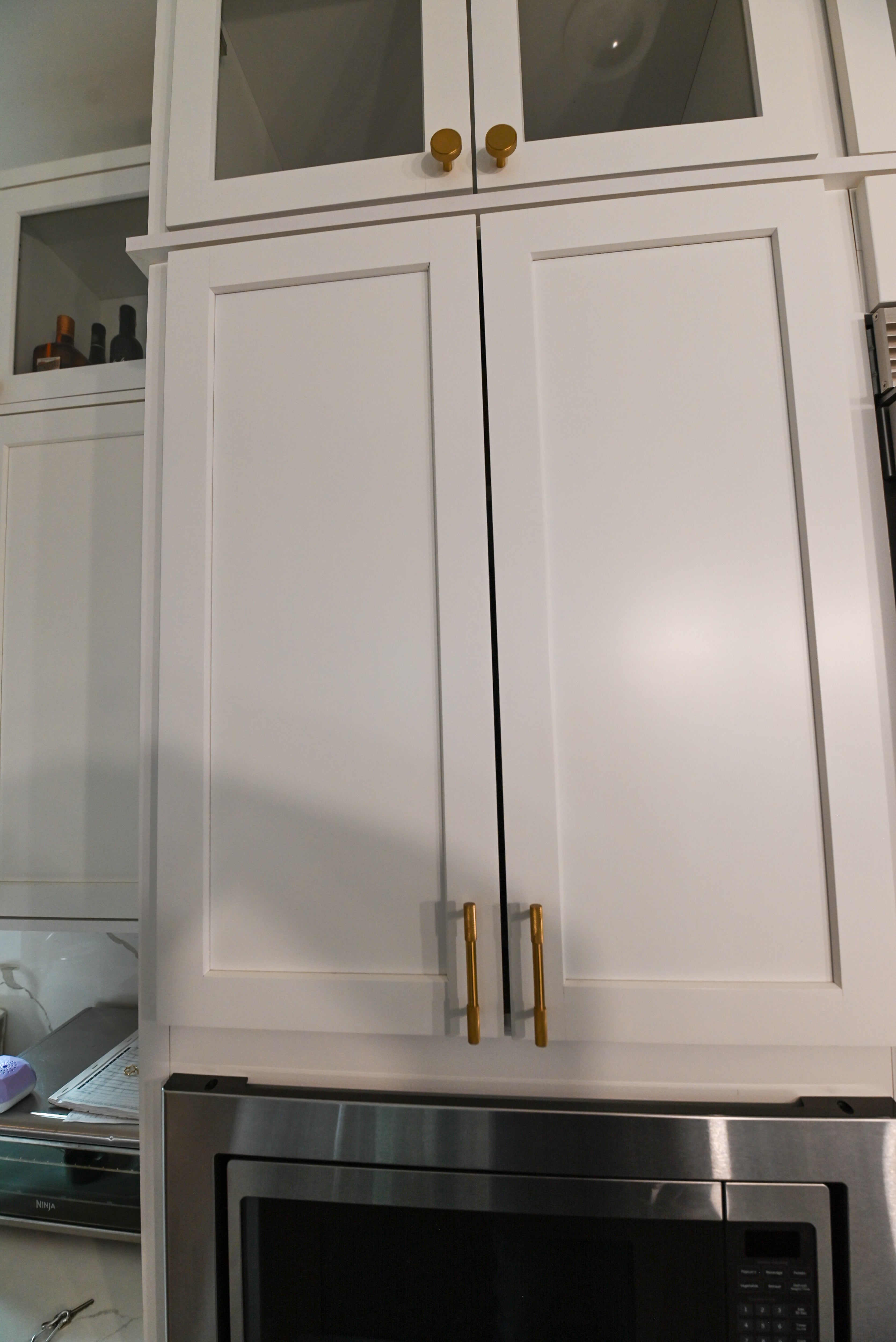 "The Lexington" Transitional White Kitchen with Black Island & Appliances