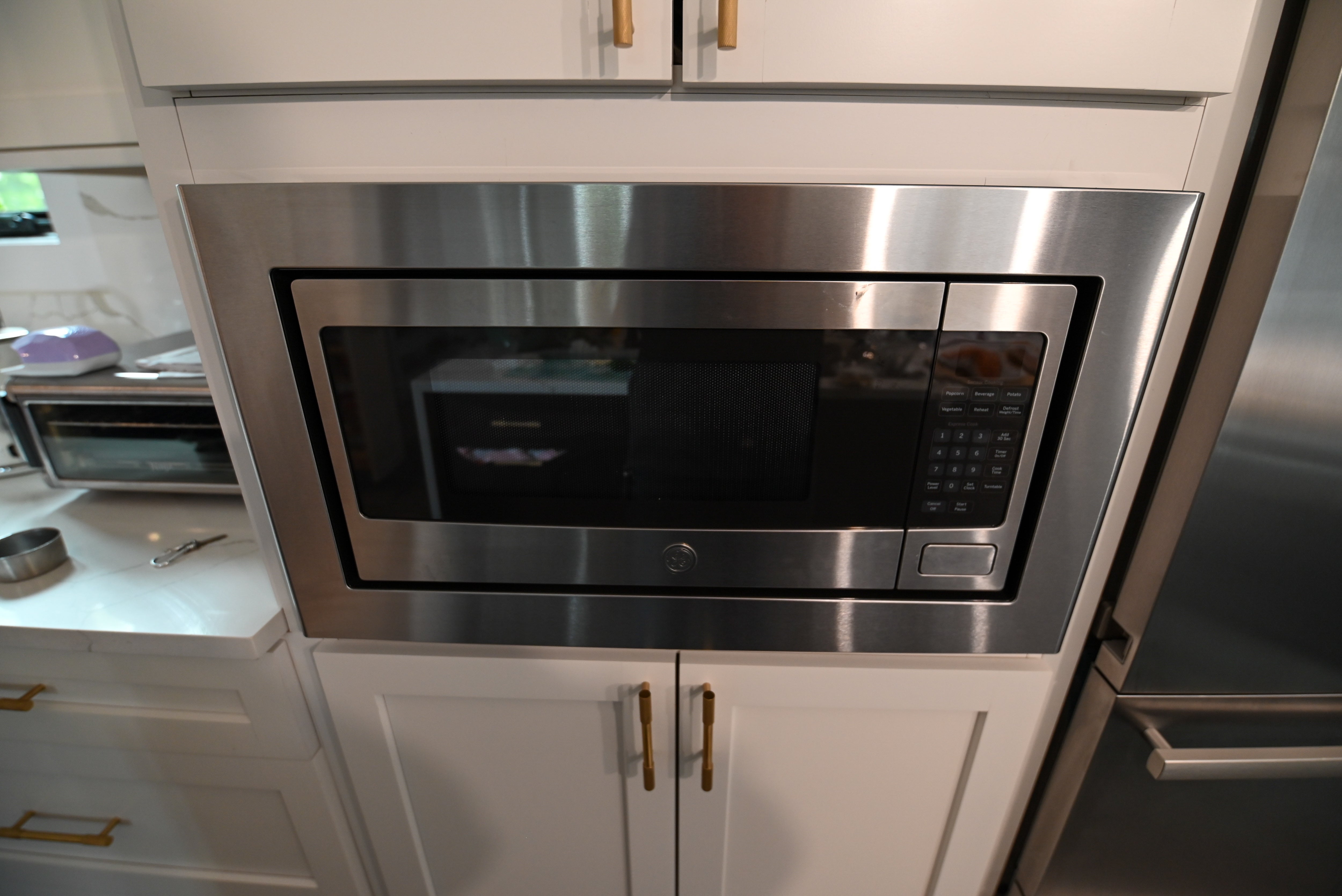 "The Lexington" Transitional White Kitchen with Black Island & Appliances
