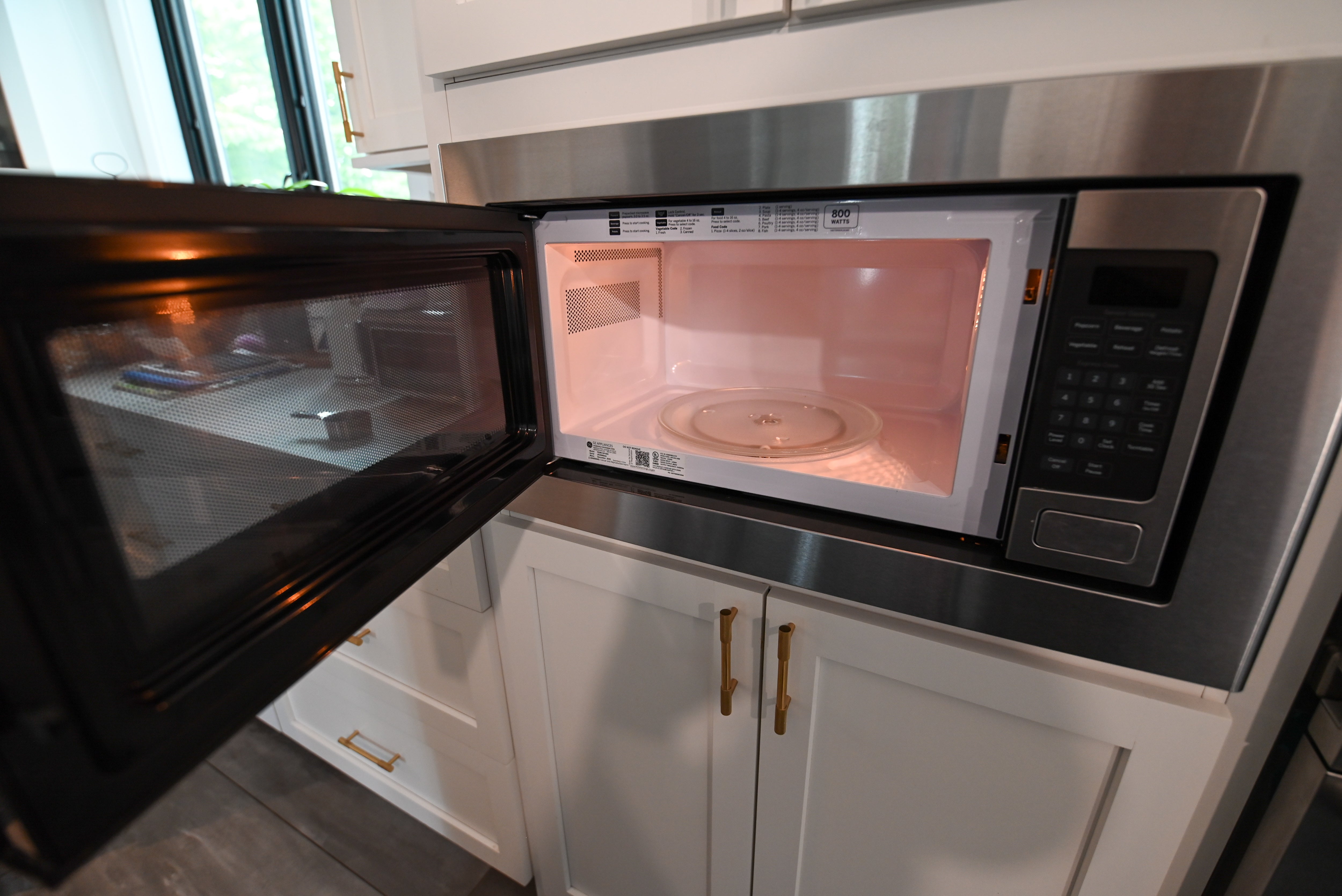 "The Lexington" Transitional White Kitchen with Black Island & Appliances