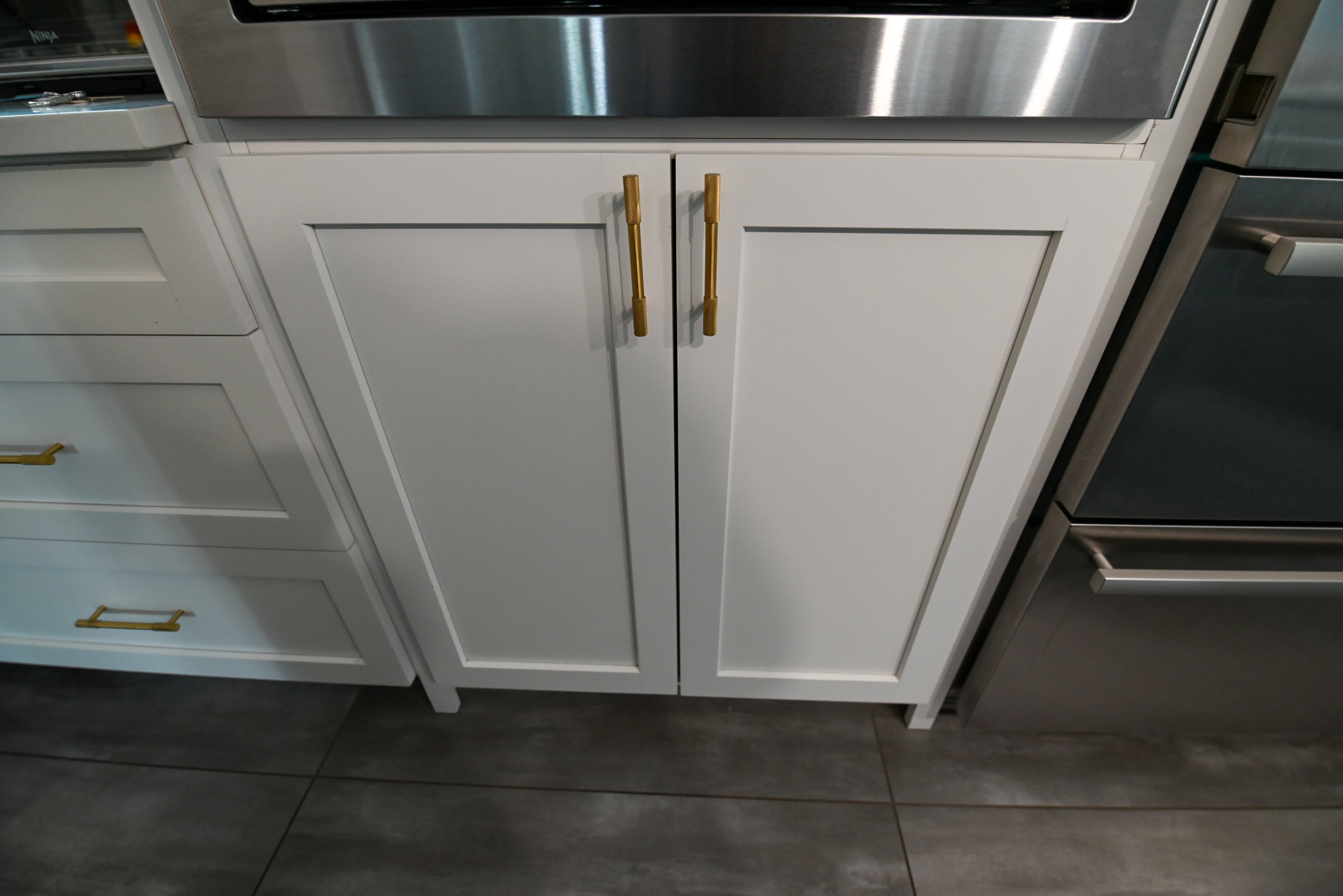 "The Lexington" Transitional White Kitchen with Black Island & Appliances