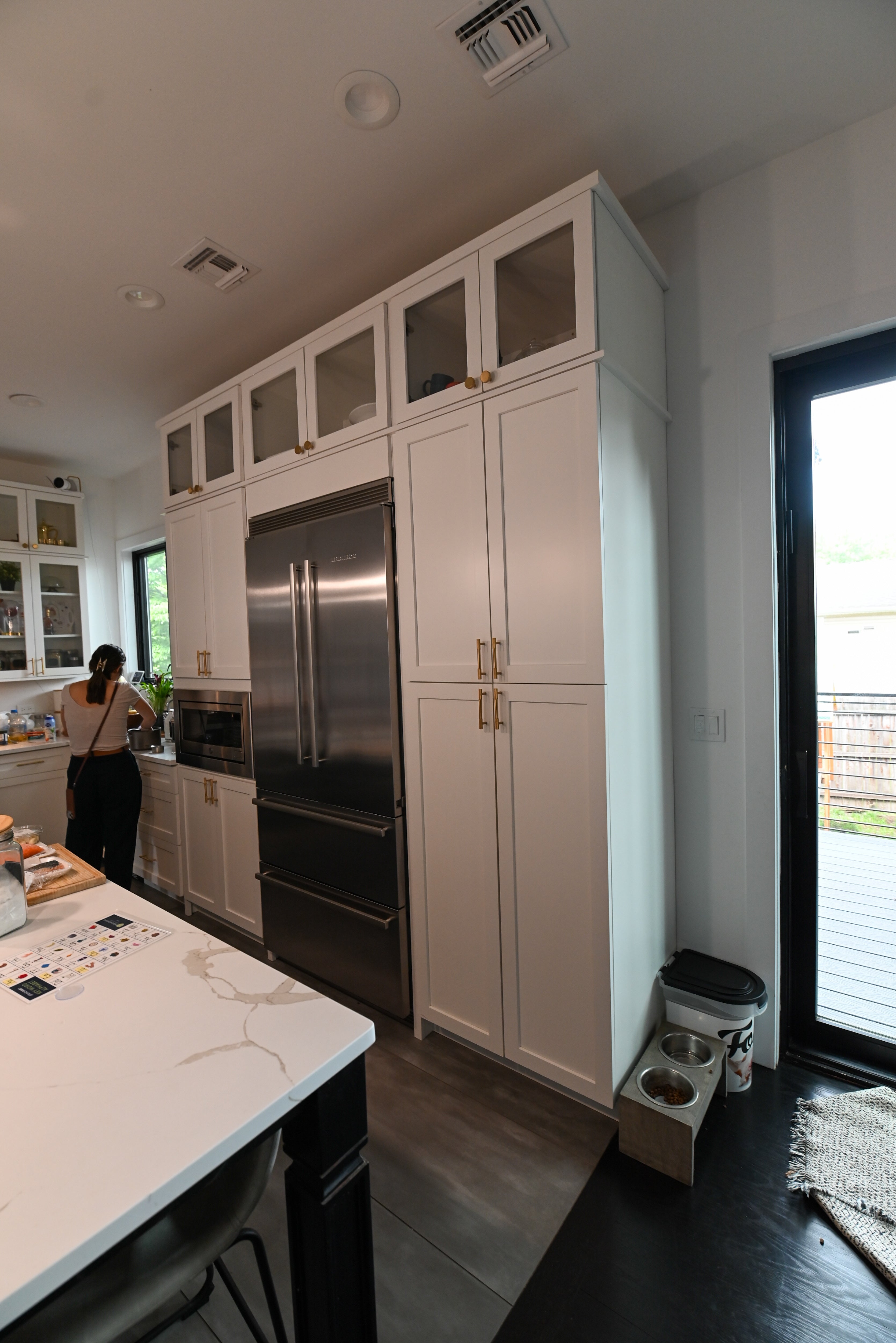 "The Lexington" Transitional White Kitchen with Black Island & Appliances