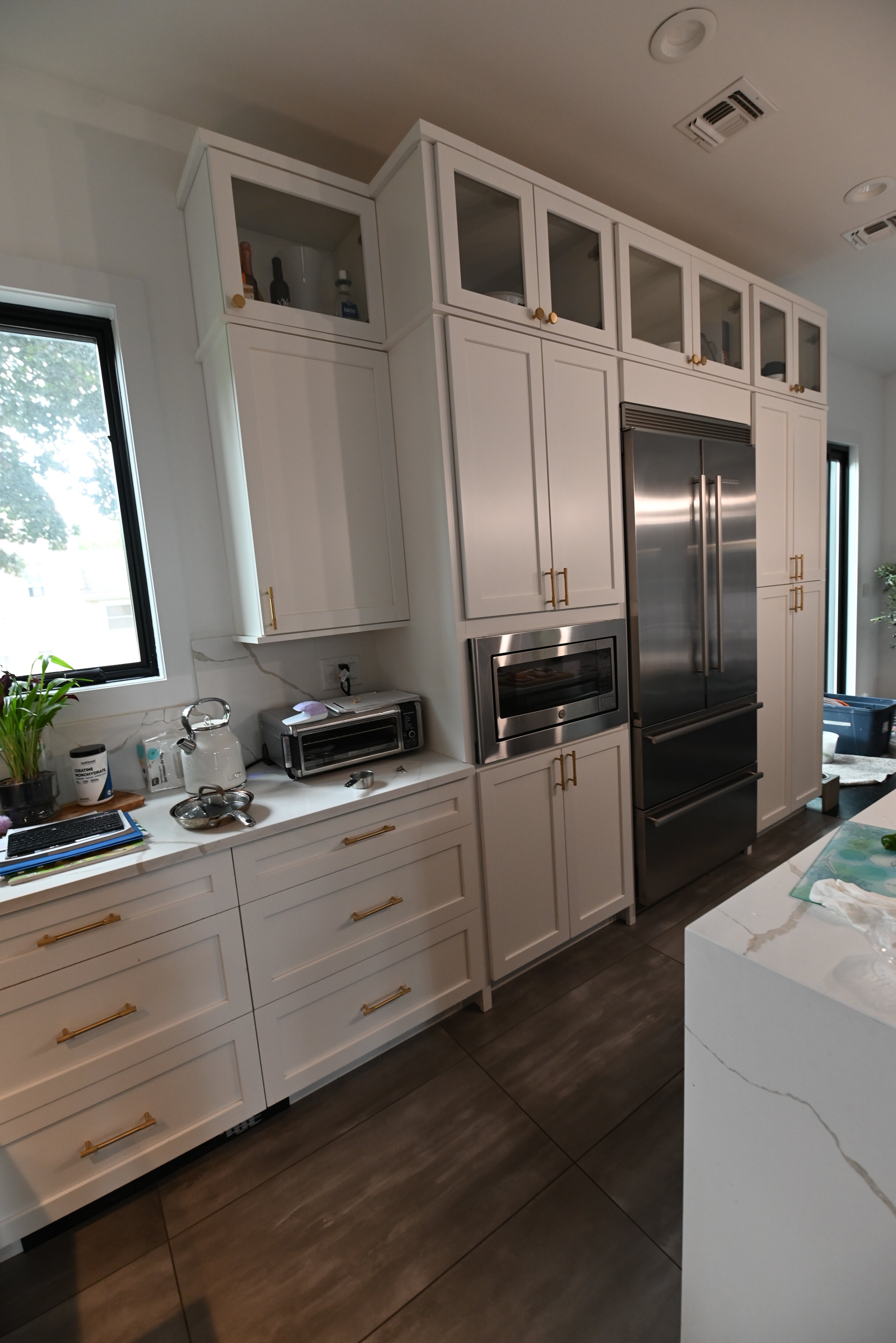 "The Lexington" Transitional White Kitchen with Black Island & Appliances