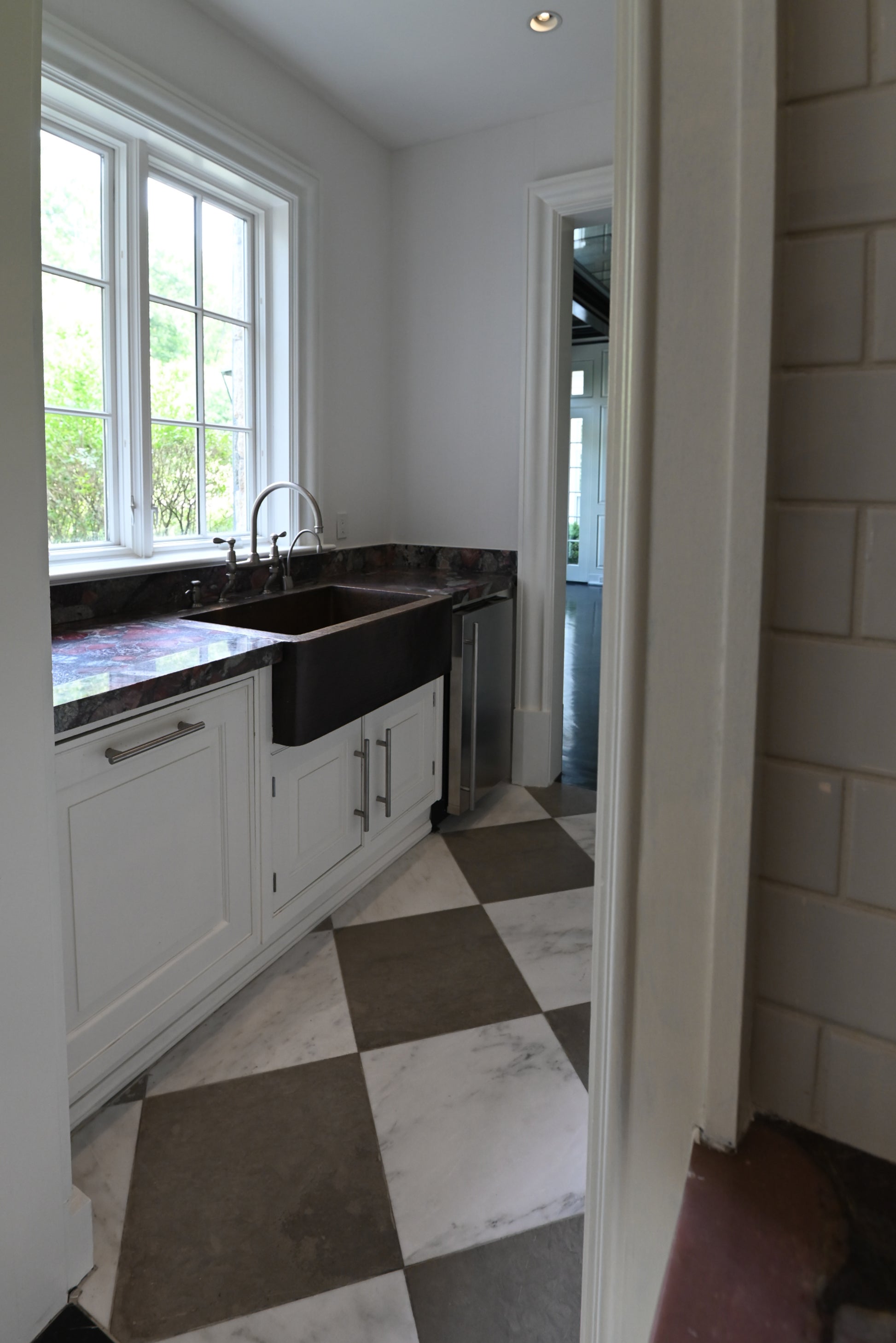 The Dove transitional white prep kitchen and butler pantry package with dishwasher and ice maker