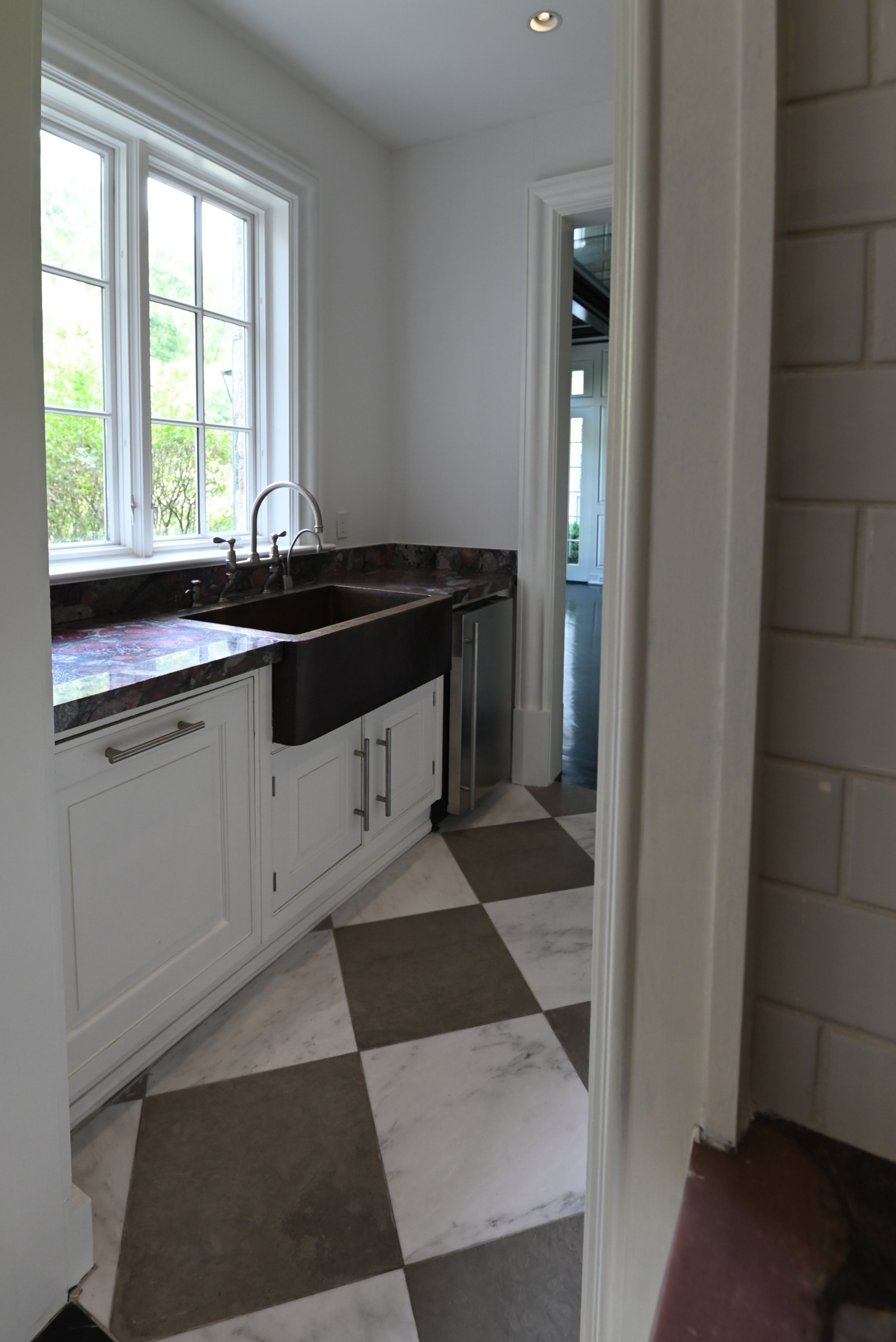 The Dove transitional white prep kitchen and butler pantry package with dishwasher and ice maker