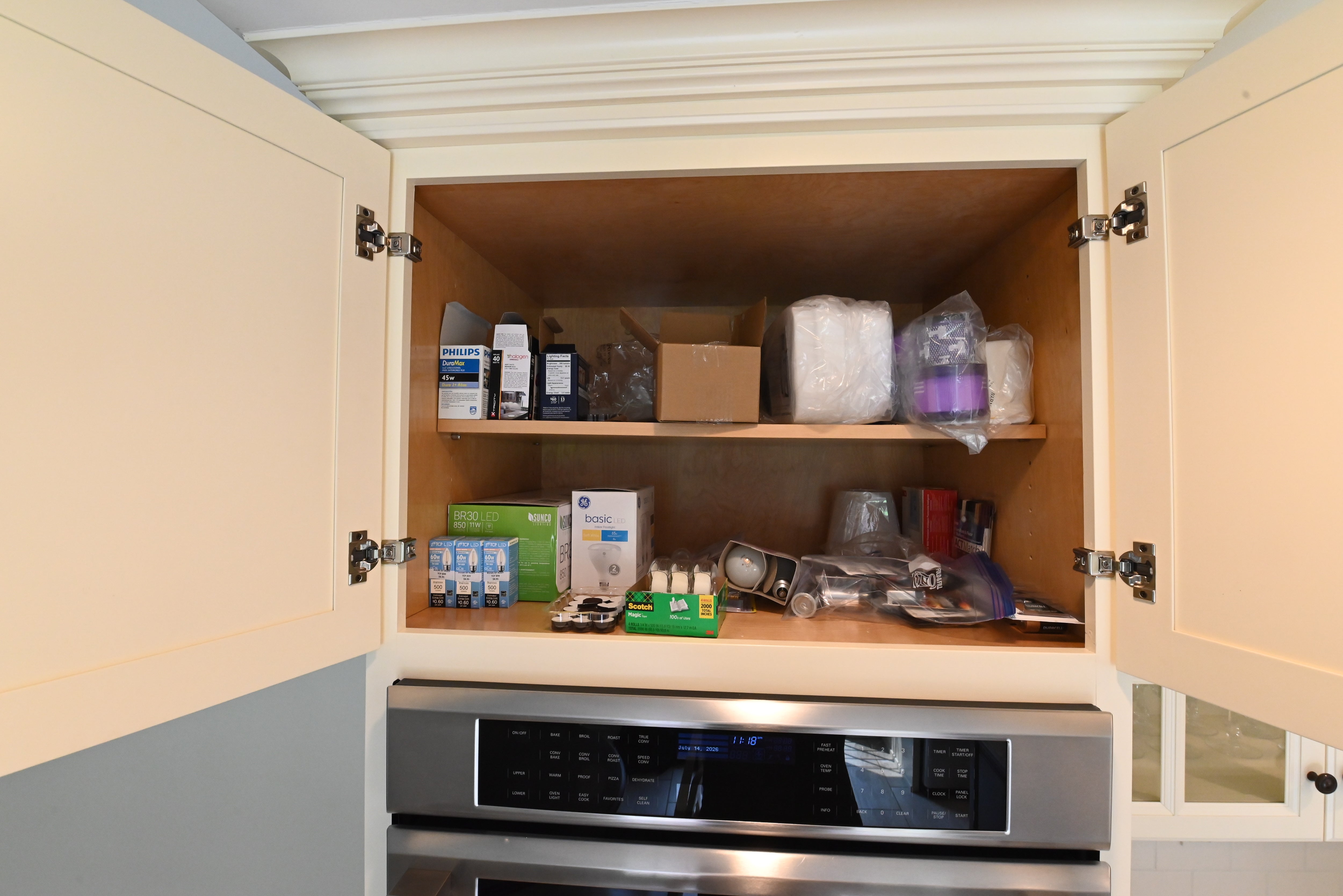 Large traditional light cream kitchen island with overhang seating and deep storage drawers