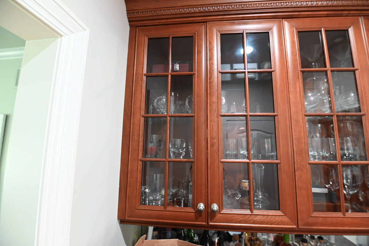 High-end architectural custom entertainment wet bar with solid hardwood finish