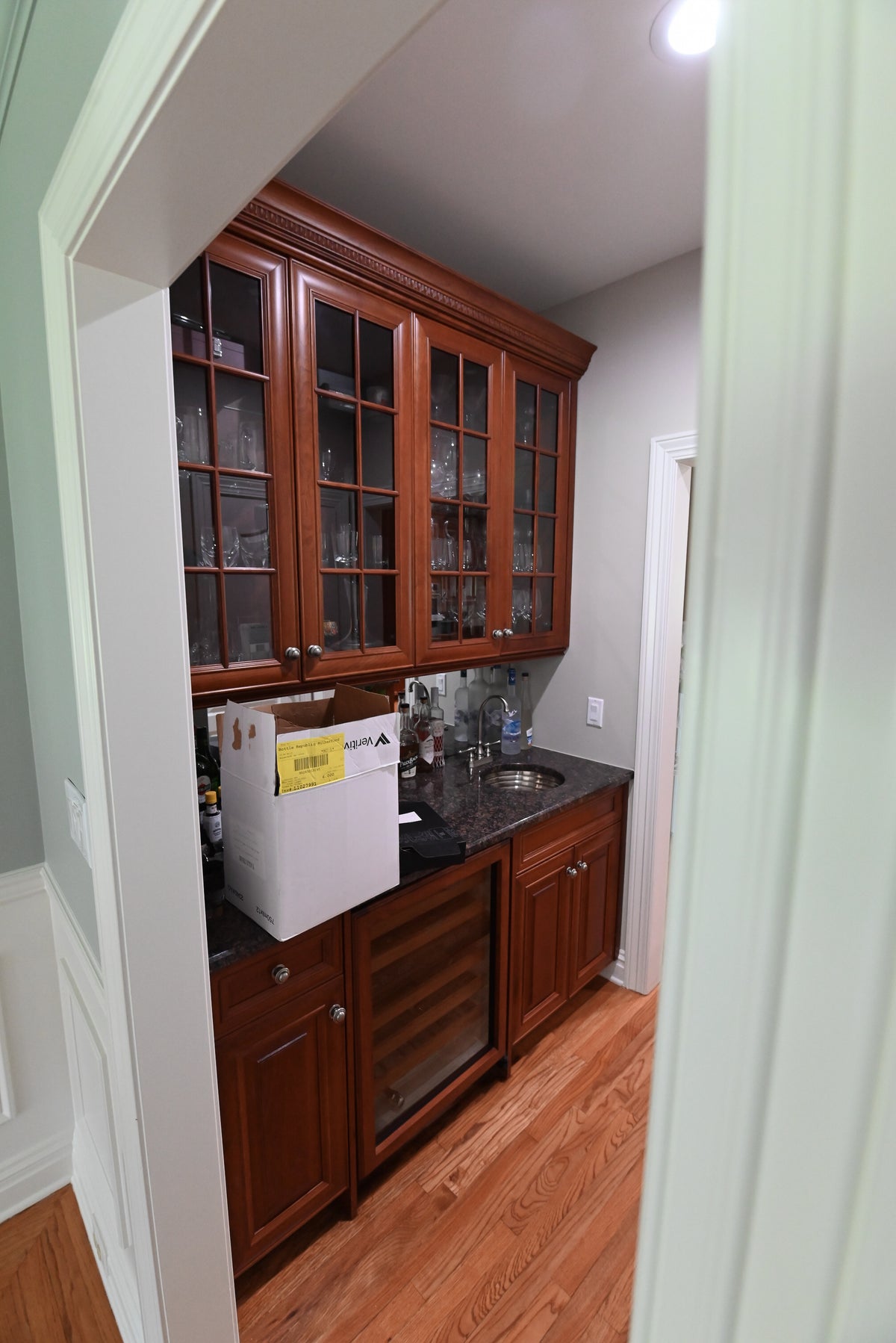 The Arlington traditional solid cherry wood wet bar cabinetry and storage setup