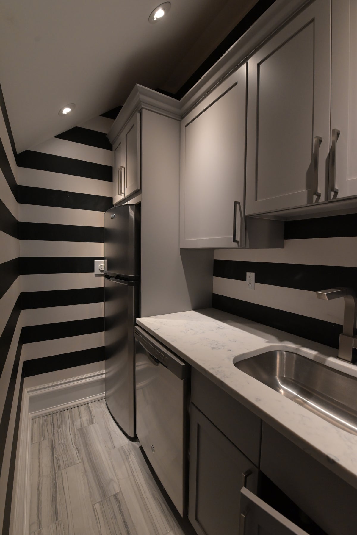 Luxury custom architectural compact kitchen suite in warm gray finish