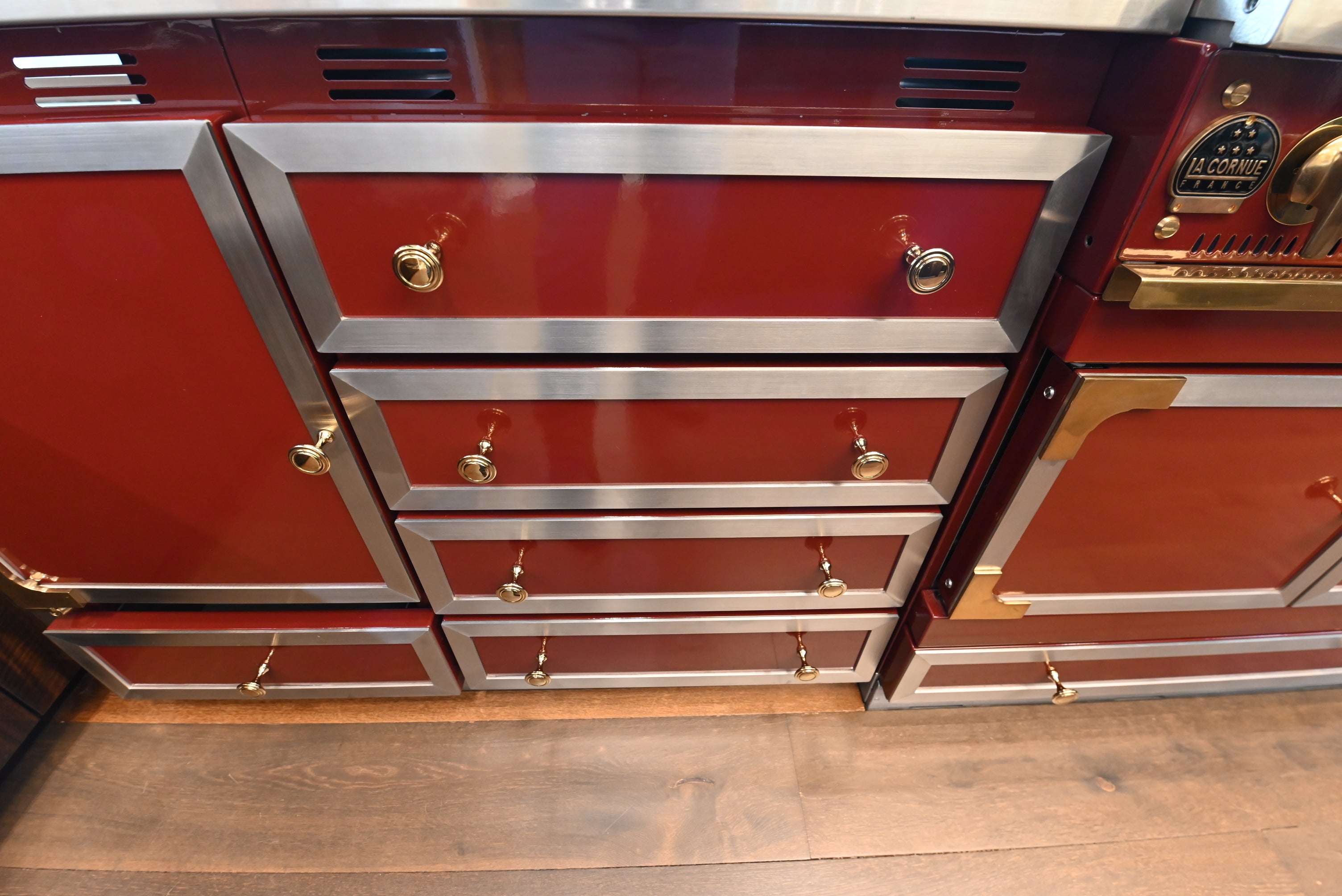 St. Charles Modern Kitchen with La Cornue Chateau Burgundy Cabinets and Glossy Eucalyptus with La Cornue Grand Palais 180 Rangetop and Custom Hood