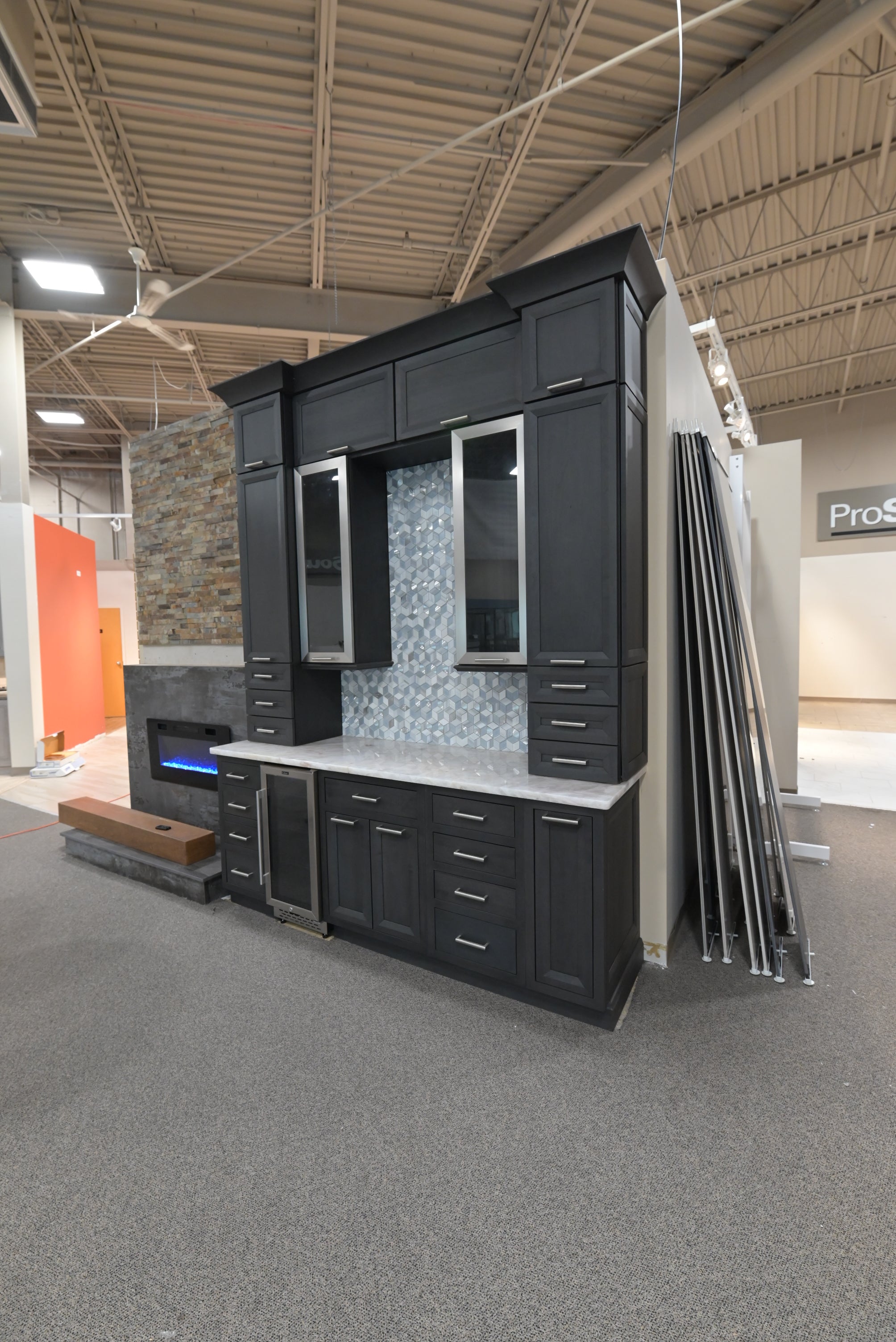 Luxury built-in home bar cabinetry in dark matte black finish