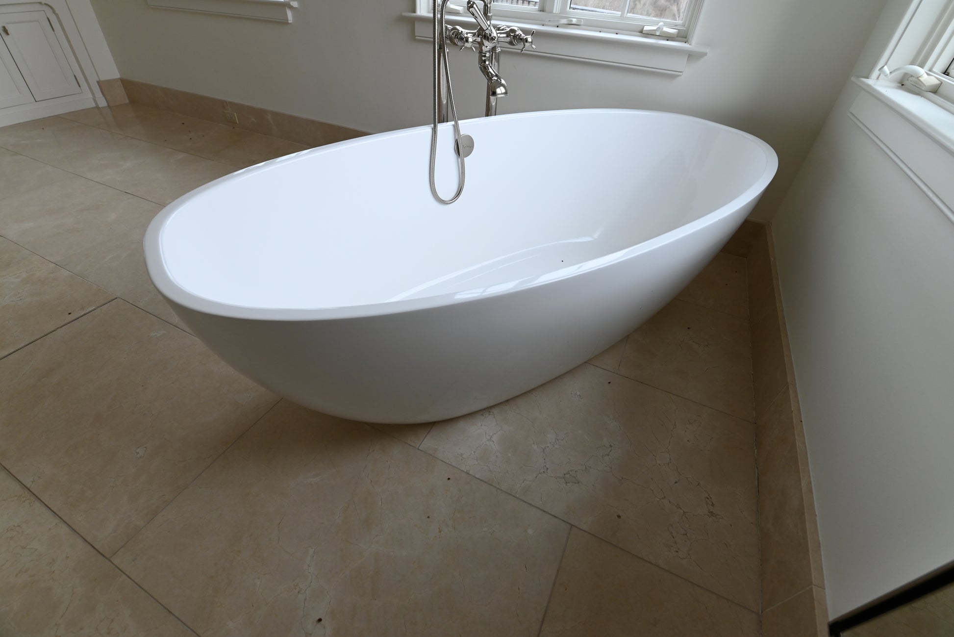 Victoria + Albert 70 inch white oval freestanding bathtub with matching tub filler