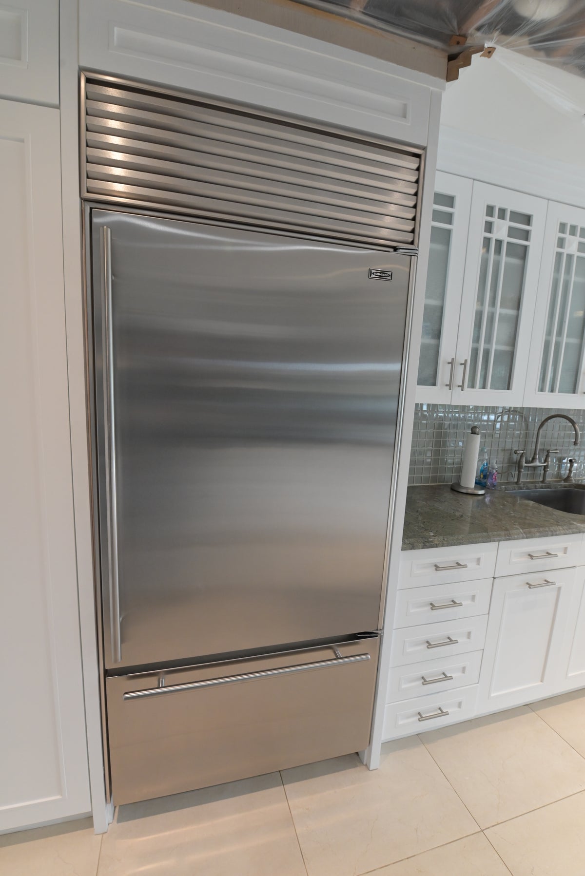 "The Roxbury" Transitional White Kitchen with Island & Sub-Zero Refrigerator