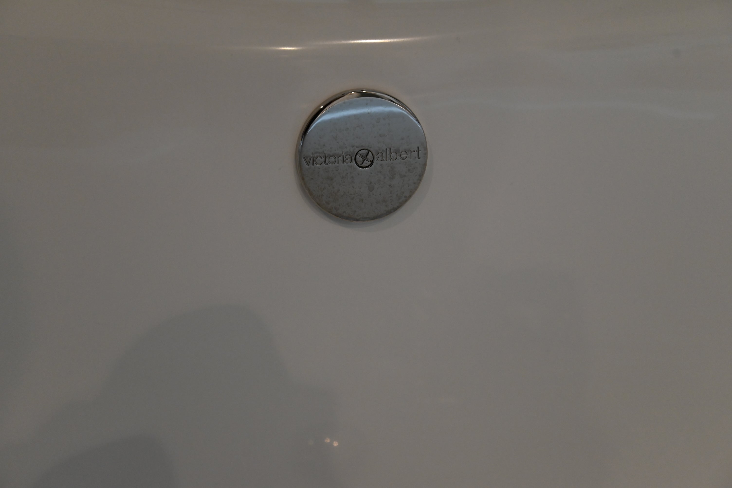 Close up detail of the smooth hand polished Volcanic Limestone surface of the Victoria and Albert 74 inch tub