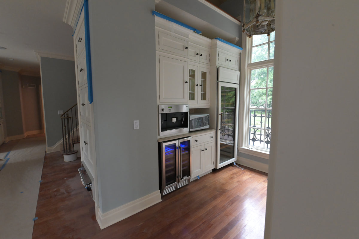 High-end architectural residential bar cabinets in classic white finish