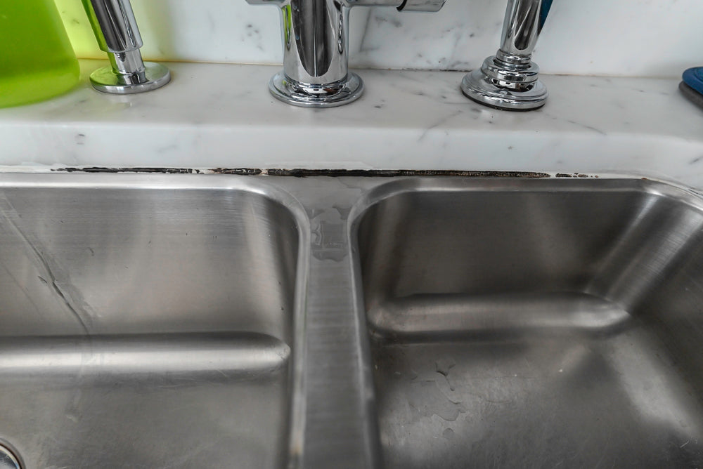 Dark Wooden Traditional Kitchen with Marble Island and Viking Appliance Package