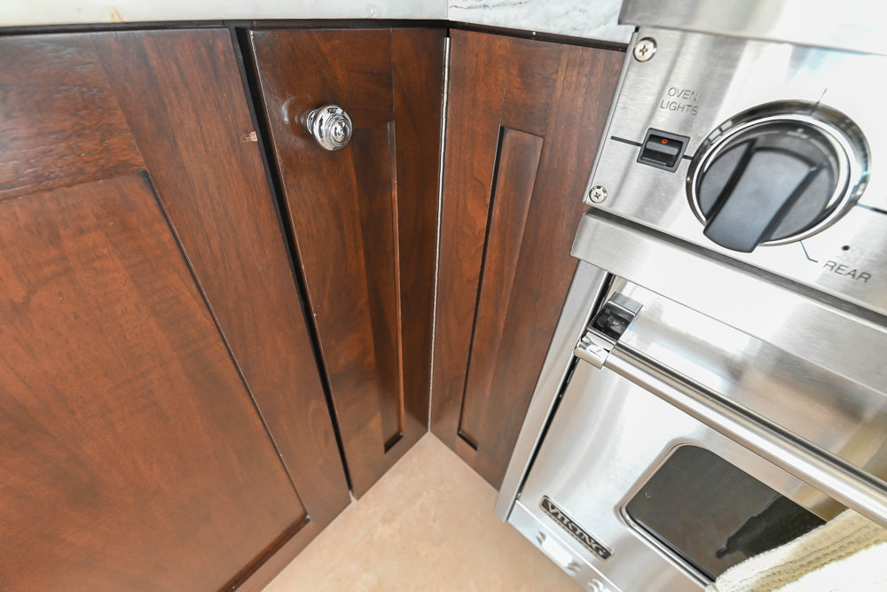 Dark Wooden Traditional Kitchen with Marble Island and Viking Appliance Package