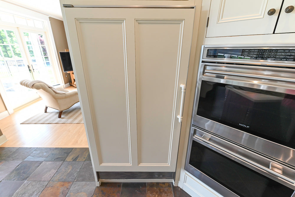 Cronin Cabinets Charm: Traditional White Kitchen with Island & Luxe Appliances