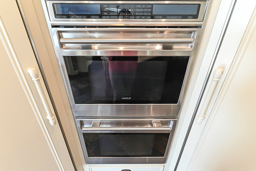 Cronin Cabinets Charm: Traditional White Kitchen with Island & Luxe Appliances