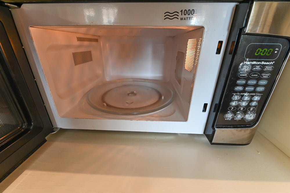 Cronin Cabinets Charm: Traditional White Kitchen with Island & Luxe Appliances