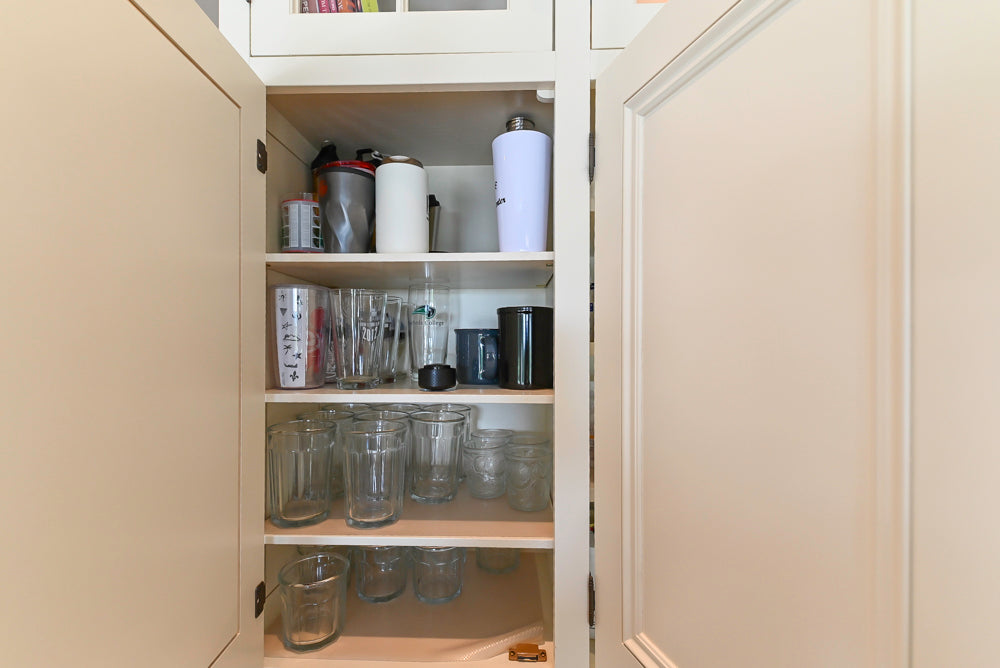 Cronin Cabinets Charm: Traditional White Kitchen with Island & Luxe Appliances