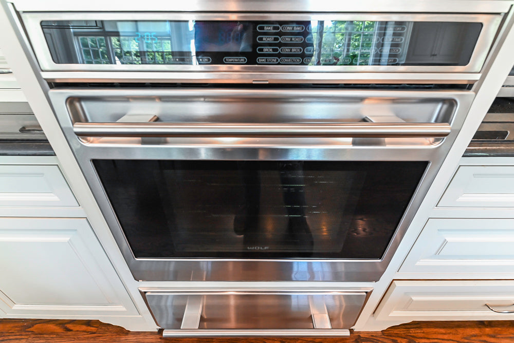 Signature Custom Cabinetry Traditional White Kitchen with Island, Desk Area & Appliances