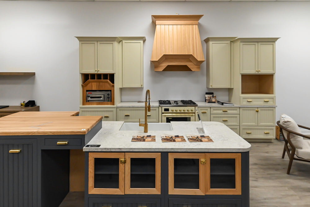 Covered Bridge Two-Tone Traditional Showroom Kitchen with Island and Caesarstone Countertops