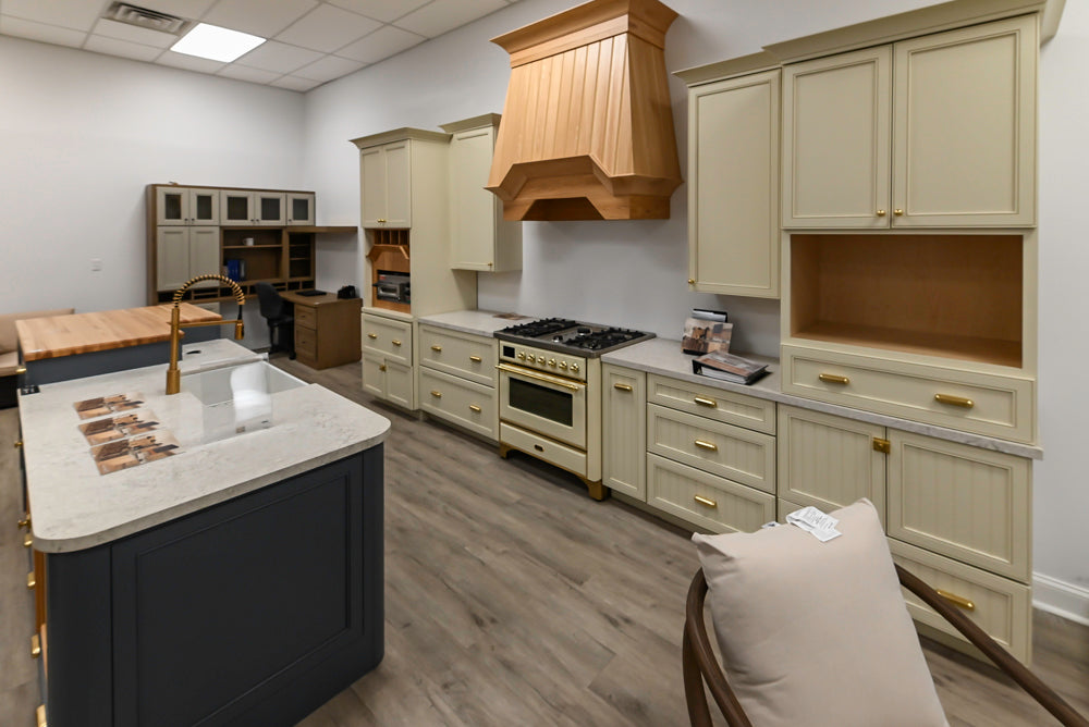 Covered Bridge Two-Tone Traditional Showroom Kitchen with Island and Caesarstone Countertops
