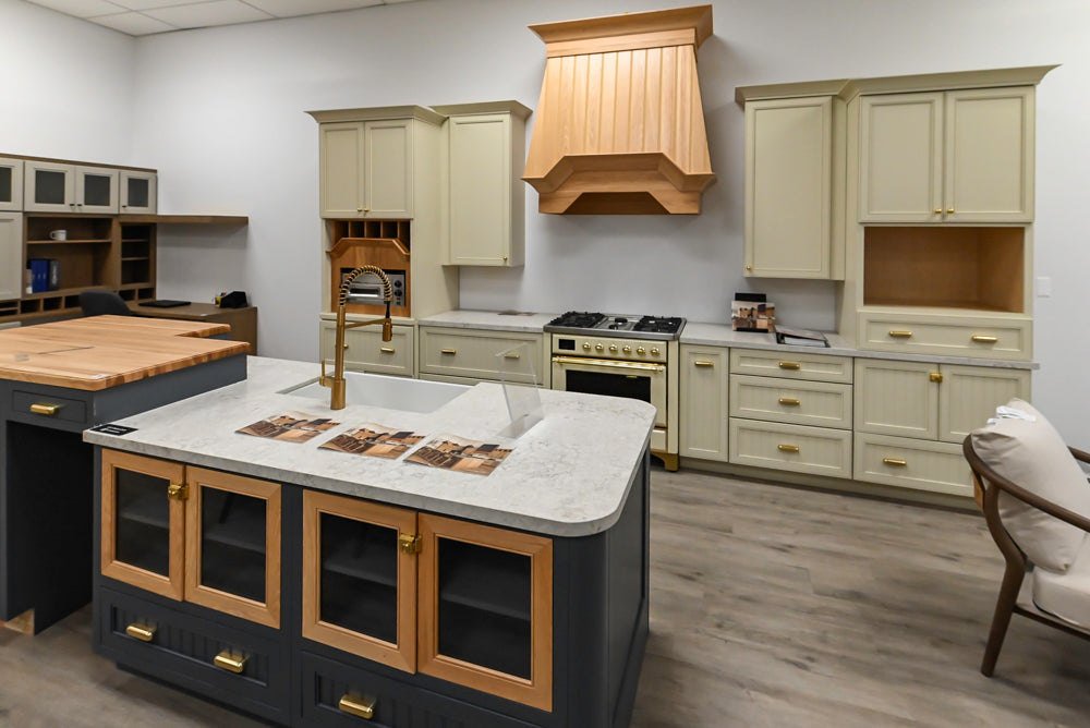 Covered Bridge Two-Tone Traditional Showroom Kitchen with Island and Caesarstone Countertops
