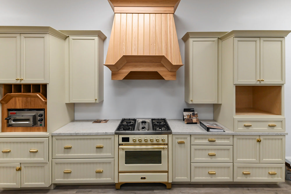 Covered Bridge Two-Tone Traditional Showroom Kitchen with Island and Caesarstone Countertops