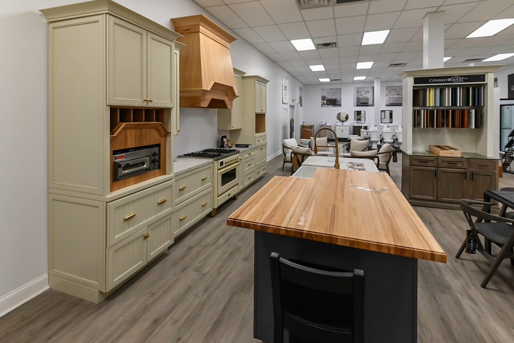 Covered Bridge Two-Tone Traditional Showroom Kitchen with Island and Caesarstone Countertops