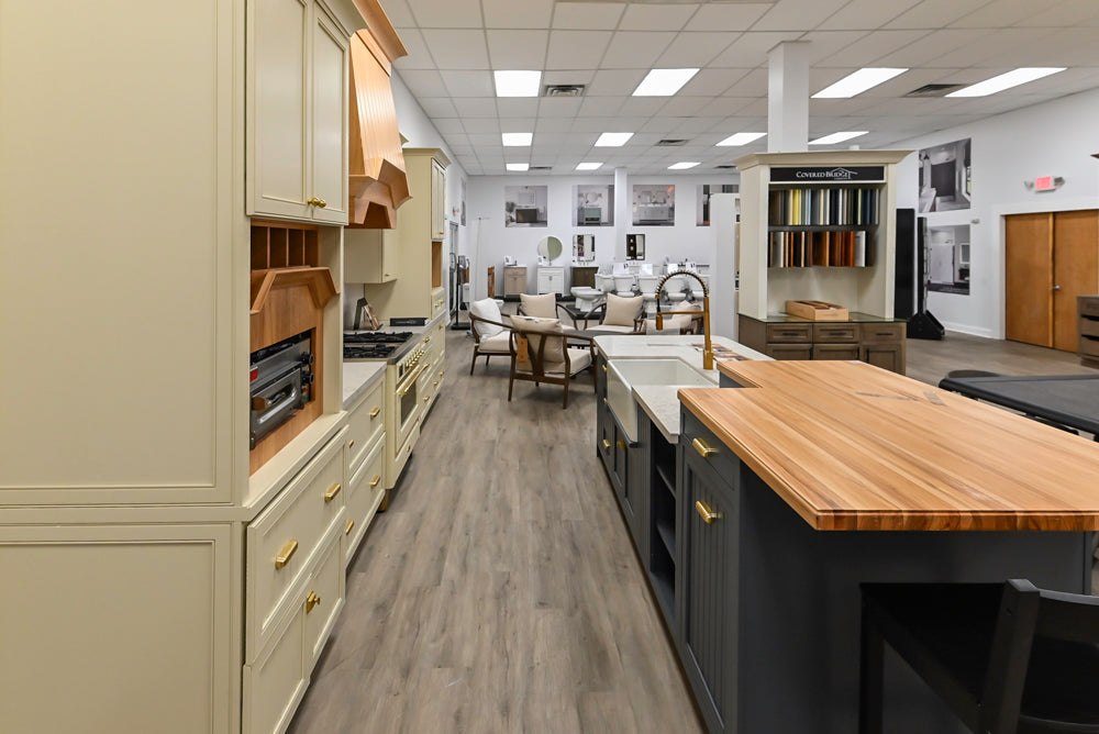 Covered Bridge Two-Tone Traditional Showroom Kitchen with Island and Caesarstone Countertops