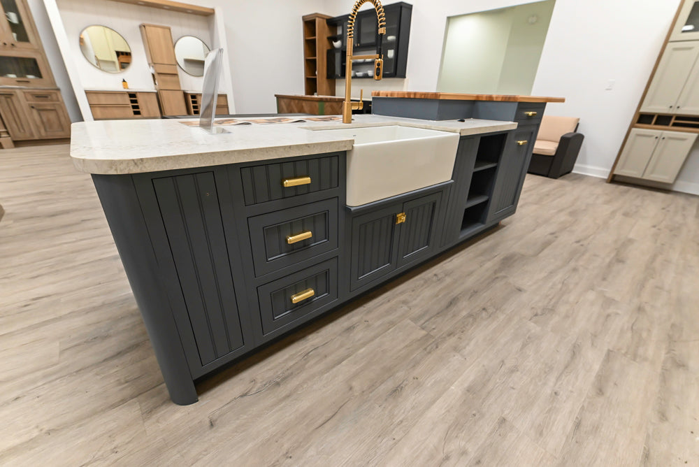 Covered Bridge Two-Tone Traditional Showroom Kitchen with Island and Caesarstone Countertops
