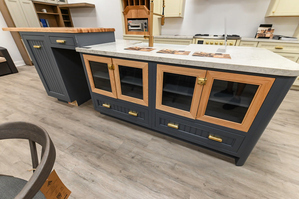 Covered Bridge Two-Tone Traditional Showroom Kitchen with Island and Caesarstone Countertops