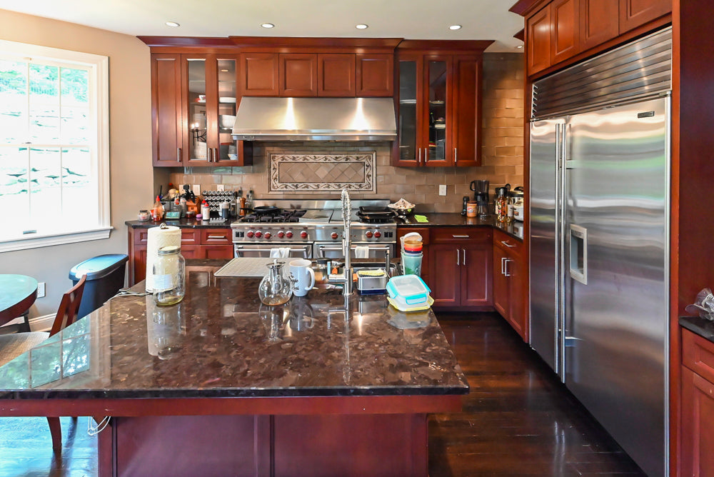 Stylish Dark Wooden Transitional Pre-Owned Kitchen with Appliances and Dark Granite Island