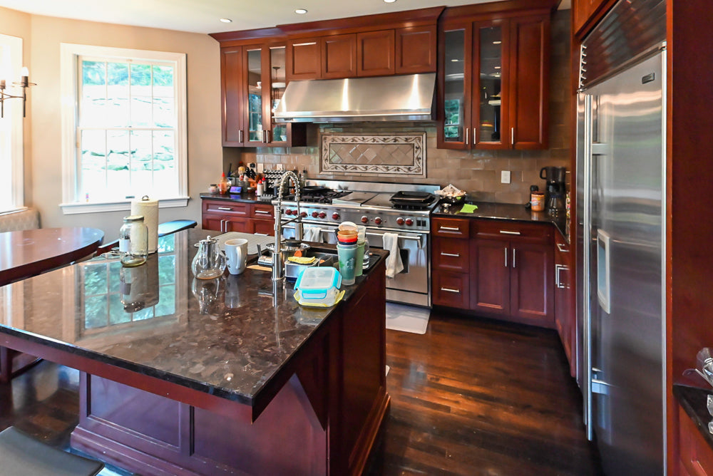 Stylish Dark Wooden Transitional Pre-Owned Kitchen with Appliances and Dark Granite Island