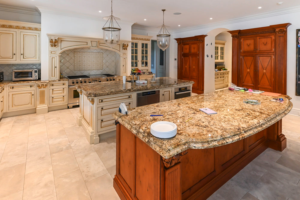Luxury cream estate kitchen layout showing double center islands and integrated butler's pantry