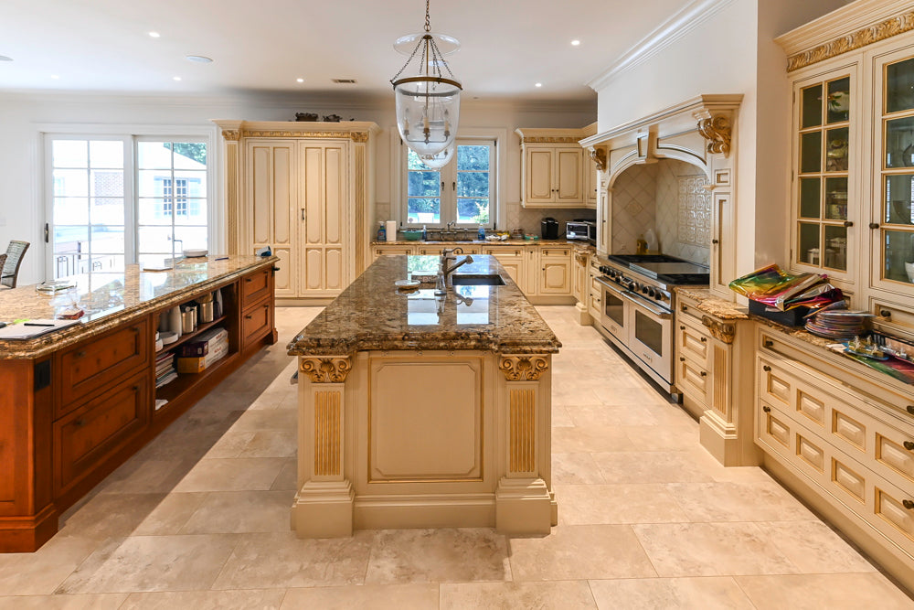 Bespoke Clive Christian cabinets showing English Yew marquetry with Sub-Zero and Wolf appliances